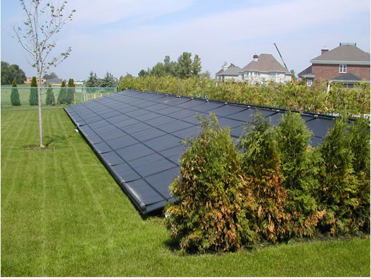 picture of solar pool heat panels mounted on ground